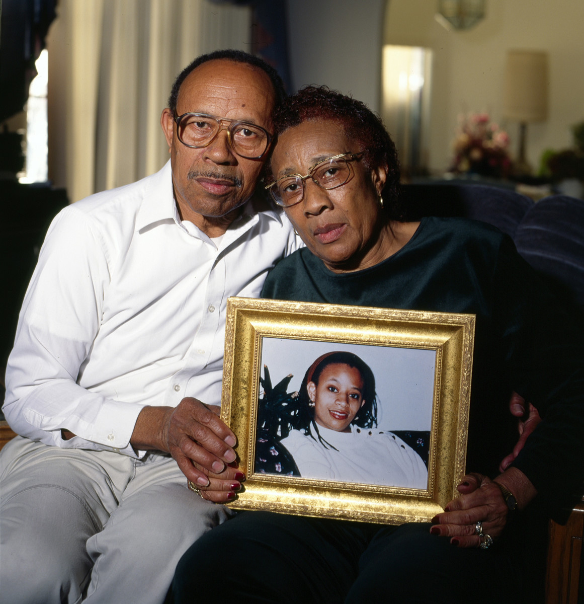 Alvin and Hazel Hayes hold a photo of their late daughter, Althea, in 1999. Hazel died in 2005.
